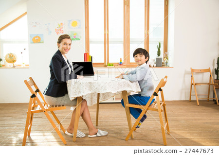 Young Student Learning English With A Foreign Female Teacher 27447673