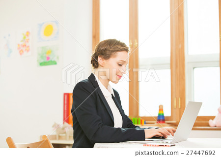 Foreign Female Teacher At Her Desk Foreign Female Teacher At Her Desk 27447692