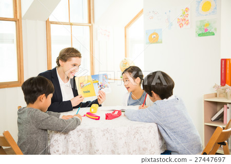 Young Students Learning English With A Foreign Female Teacher 27447697