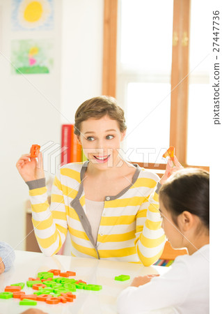 Young Students Learning English With A Foreign Female Teacher 27447736