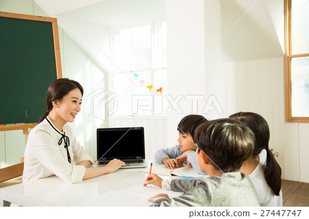 Young Students Learning With A Female Teacher 27447747