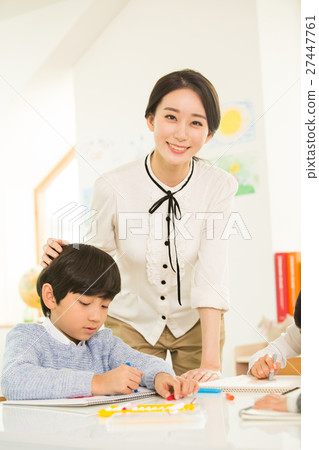 Young Student Learning With A Female Teacher 27447761