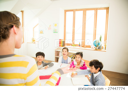 Young Students Learning With A Foreign Female Teacher 27447774