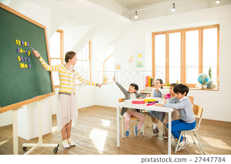 Young Students Learning With A Foreign Female Teacher Young Students Learning With A Foreign Female Teacher 27447784