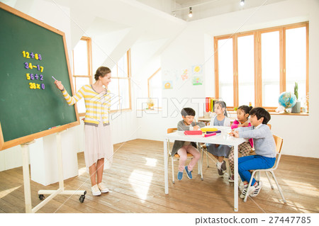 Young Students Learning With A Foreign Female Teacher 27447785