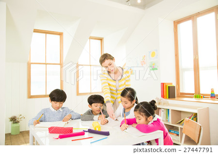 Young Students Learning With A Foreign Female Teacher Young Students Learning With A Foreign Female Teacher 27447791