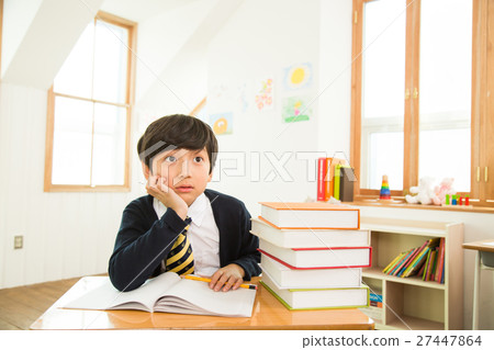 Young Student At The Desk 27447864