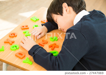 Young Student Sleeping On The Desk 27447869