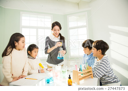 Young Students In Science Class With A Female Teacher Young Students In Science Class With A Female Teacher 27447873