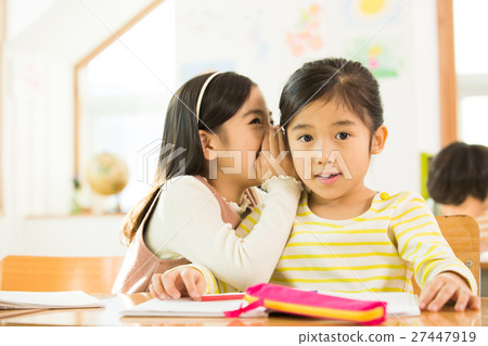 Two Young Female Students In Class 27447919