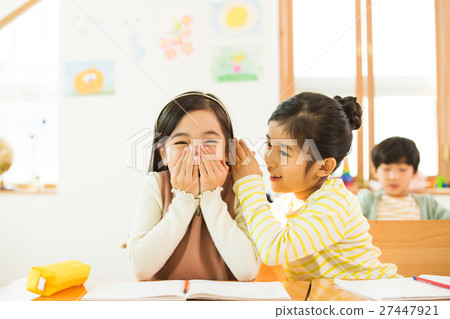 Two Young Female Students In Class 27447921
