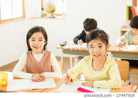 Two Young Female Students In Class 27447926