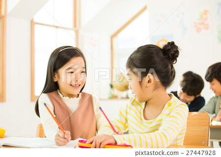 Two Young Female Students In Class 27447928