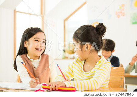 Two Young Female Students In Class Two Young Female Students In Class 27447940