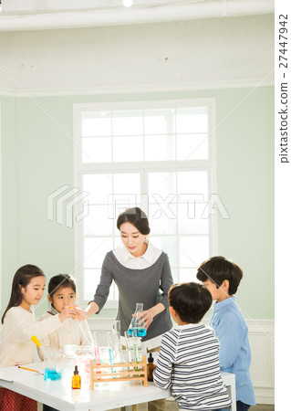 Young Students In Science Class With A Female Teacher Young Students In Science Class With A Female Teacher 27447942
