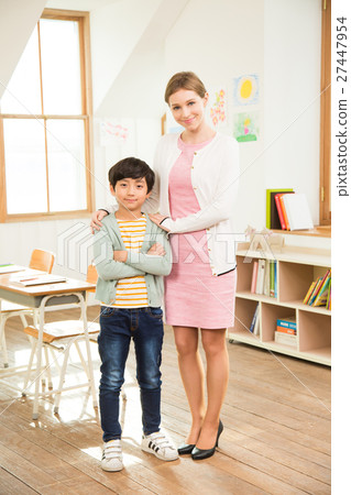 A Student Standing Next To Female English Teacher A Student Standing Next To Female English Teacher 27447954