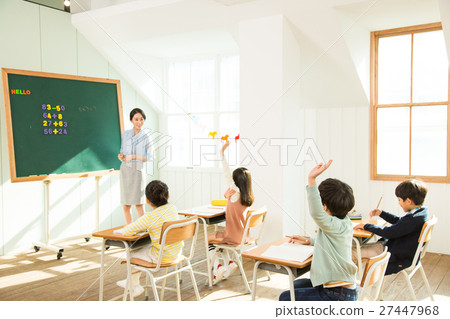 Female Teacher Teaching Math To Young Students Female Teacher Teaching Math To Young Students 27447968