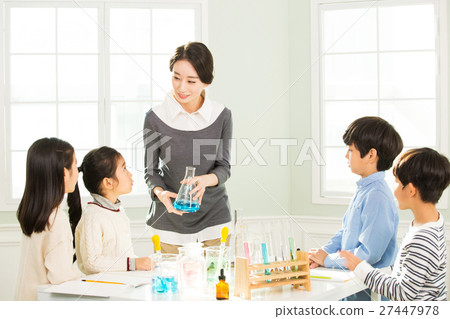 Young Students In Science Class With A Female Teacher Young Students In Science Class With A Female Teacher 27447978