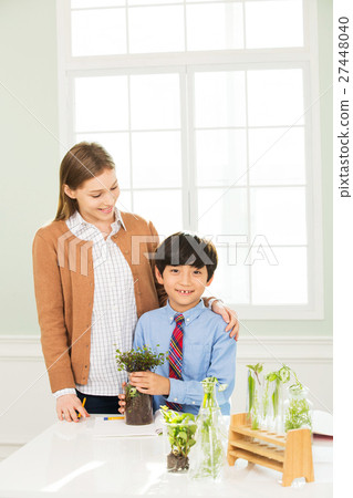 Young Student In Biology Class With A Female Teacher Young Student In Biology Class With A Female Teacher 27448040