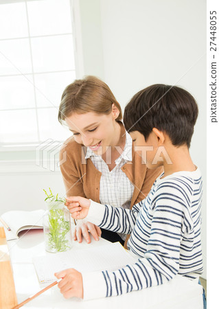 Young Student In Biology Class With A Female Teacher Young Student In Biology Class With A Female Teacher 27448055