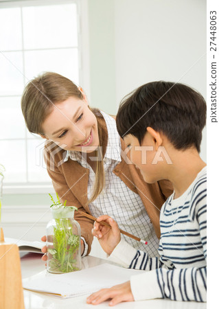 Young Student In Biology Class With A Female Teacher Young Student In Biology Class With A Female Teacher 27448063