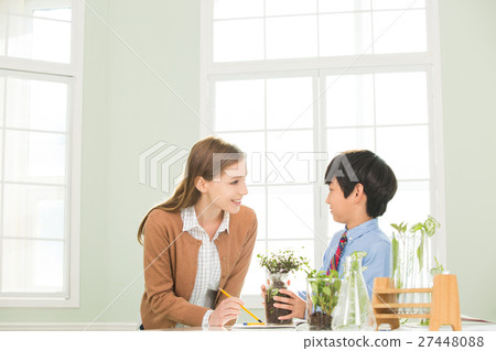 Young Student In Biology Class With A Female Teacher Young Student In Biology Class With A Female Teacher 27448088