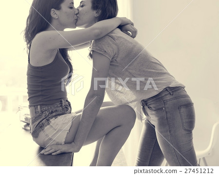 Lesbian Couple Together Indoors Concept Lesbian Couple Together Indoors Concept 27451212