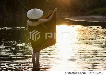 Backside of A beautiful Village women undress at the nature river when sunrise with lens flare, countryside and Folkways concept Backside of A beautiful Village women undress at the nature river when sunrise with lens flare, countryside and Folkways concept 27455253