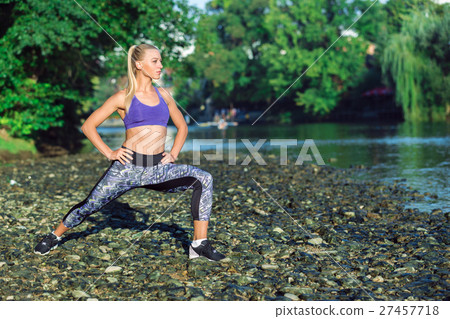 Balancing. Female practises balancing at nature Balancing. Female practises balancing at nature 27457718