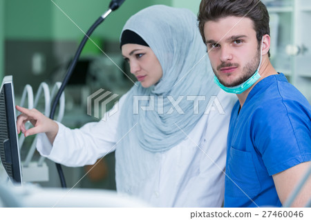 Arab students with hijab while working on the 27460046