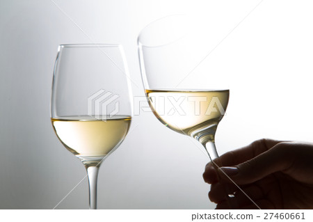 Women's hand with white wine Women's hand with white wine 27460661