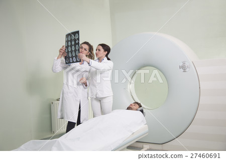 Radiologic technician and Patient being scanned Radiologic technician and Patient being scanned 27460691