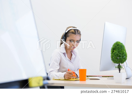 Beautiful young business woman in modern office Beautiful young business woman in modern office 27461017