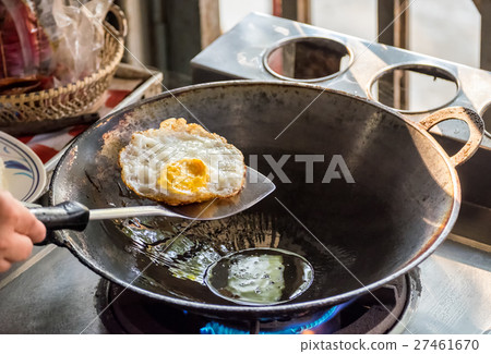Fried egg cooked on pan Fried egg cooked on pan 27461670