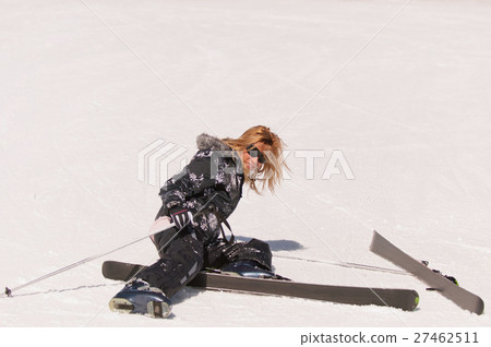 Fallen female skier 27462511