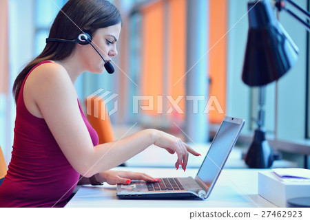 Businesswoman Showing Graph On Monitor In Office. Businesswoman Showing Graph On Monitor In Office. 27462923