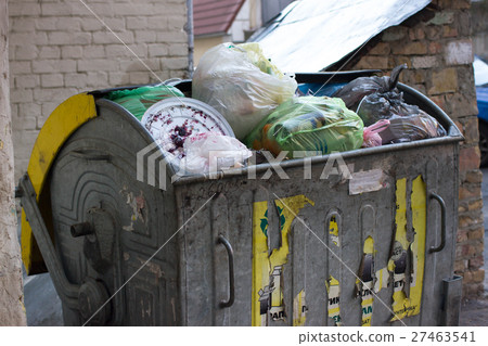 Outdoor trash bin with food waste. Not sorted 27463541
