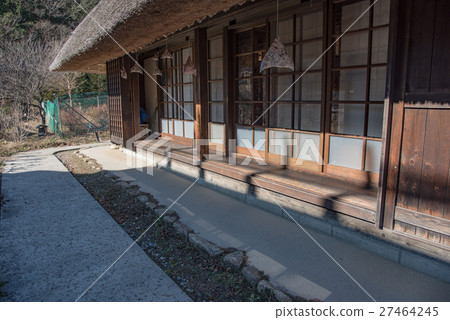 Edge side of an old private house in winter days 27464245