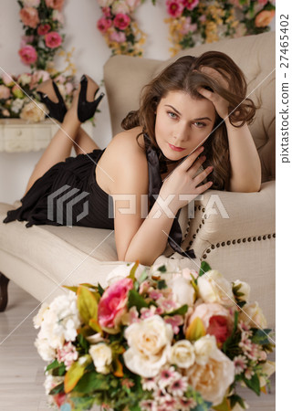 Beautiful girl at the flower interior Beautiful girl at the flower interior 27465402