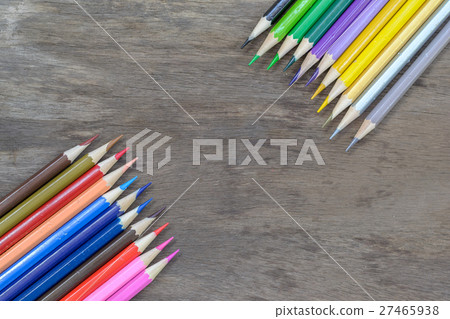 Color pencils on wood background 27465938