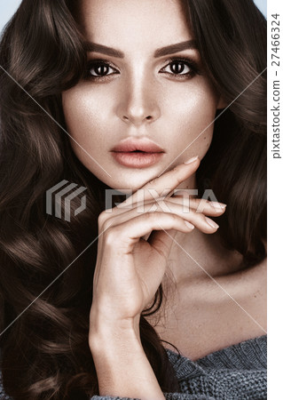 Beautiful woman with healthy skin and hair curls Beautiful woman with healthy skin and hair curls 27466324