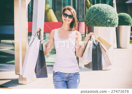 Happy Young Woman Holding Shopping Bags Happy Young Woman Holding Shopping Bags 27471678