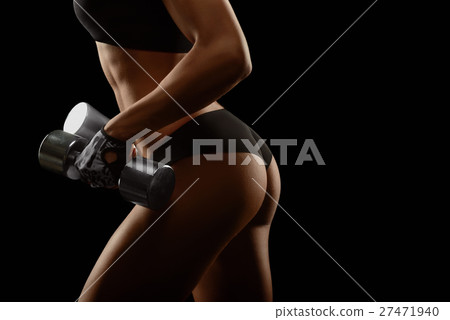 Shots of a fit female with dumbbells Shots of a fit female with dumbbells 27471940