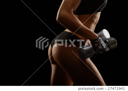 Shots of a fit female with dumbbells  27471941