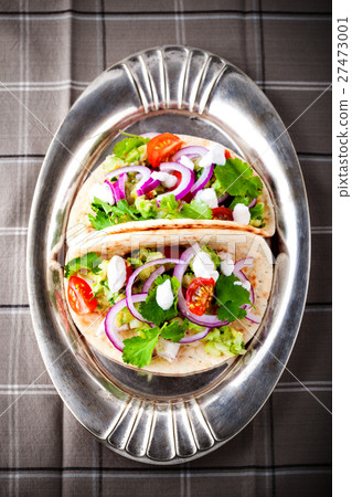 Chicken Tacos with vegetables on a pan 27473001