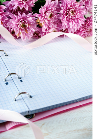 Notebook and chrysanthemum. Copyspace 27474141