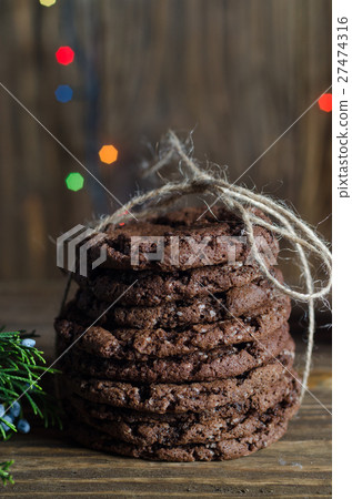 Stack of freshly baked chocolate chip cookies on Stack of freshly baked chocolate chip cookies on 27474316