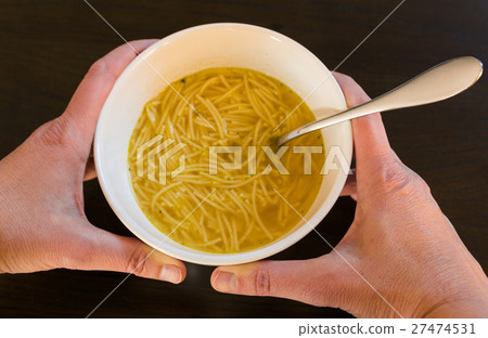 stock photo: female hands holding a bowl with european noodle