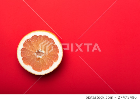 grapefruit with red background grapefruit with red background 27475486