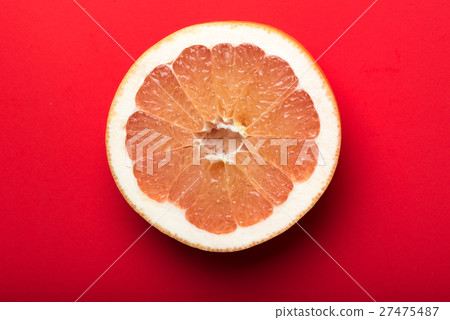 grapefruit with red background grapefruit with red background 27475487